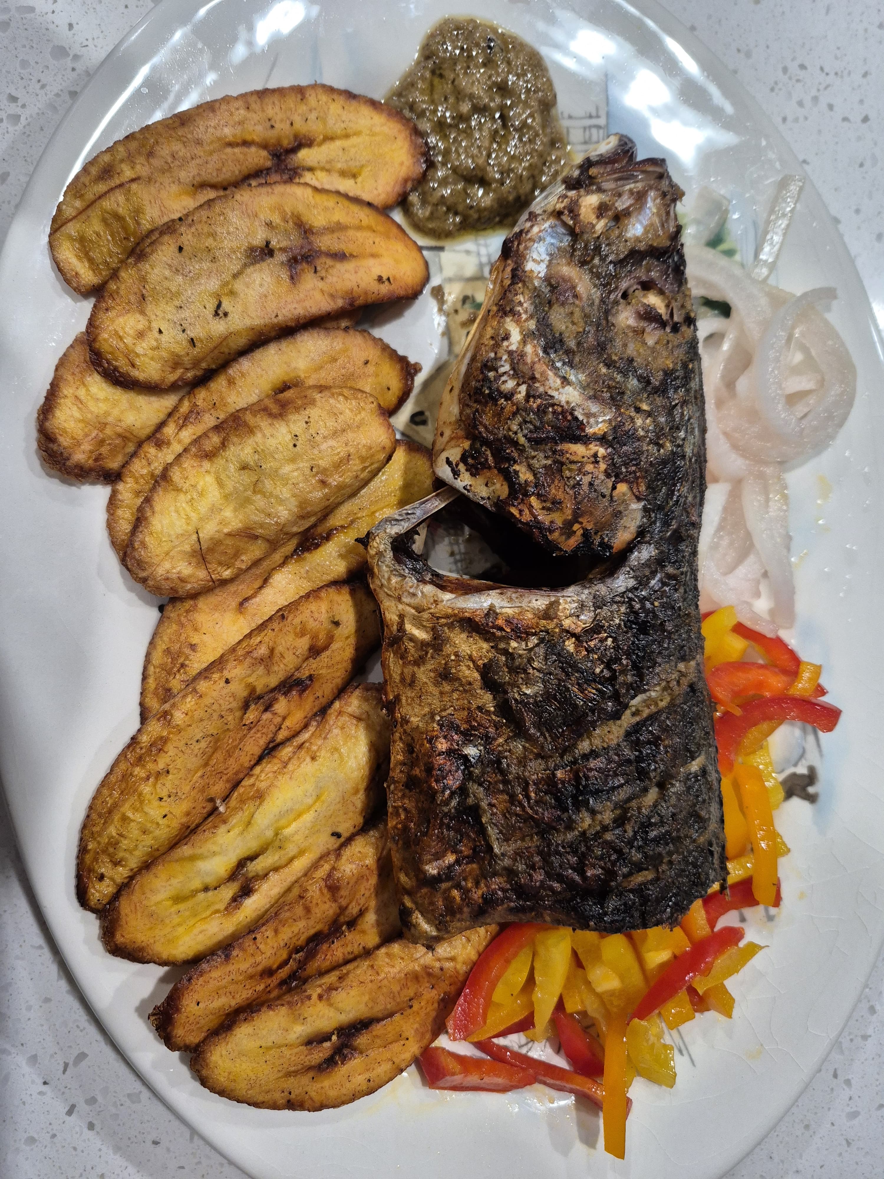Grilled fish with fried plantains